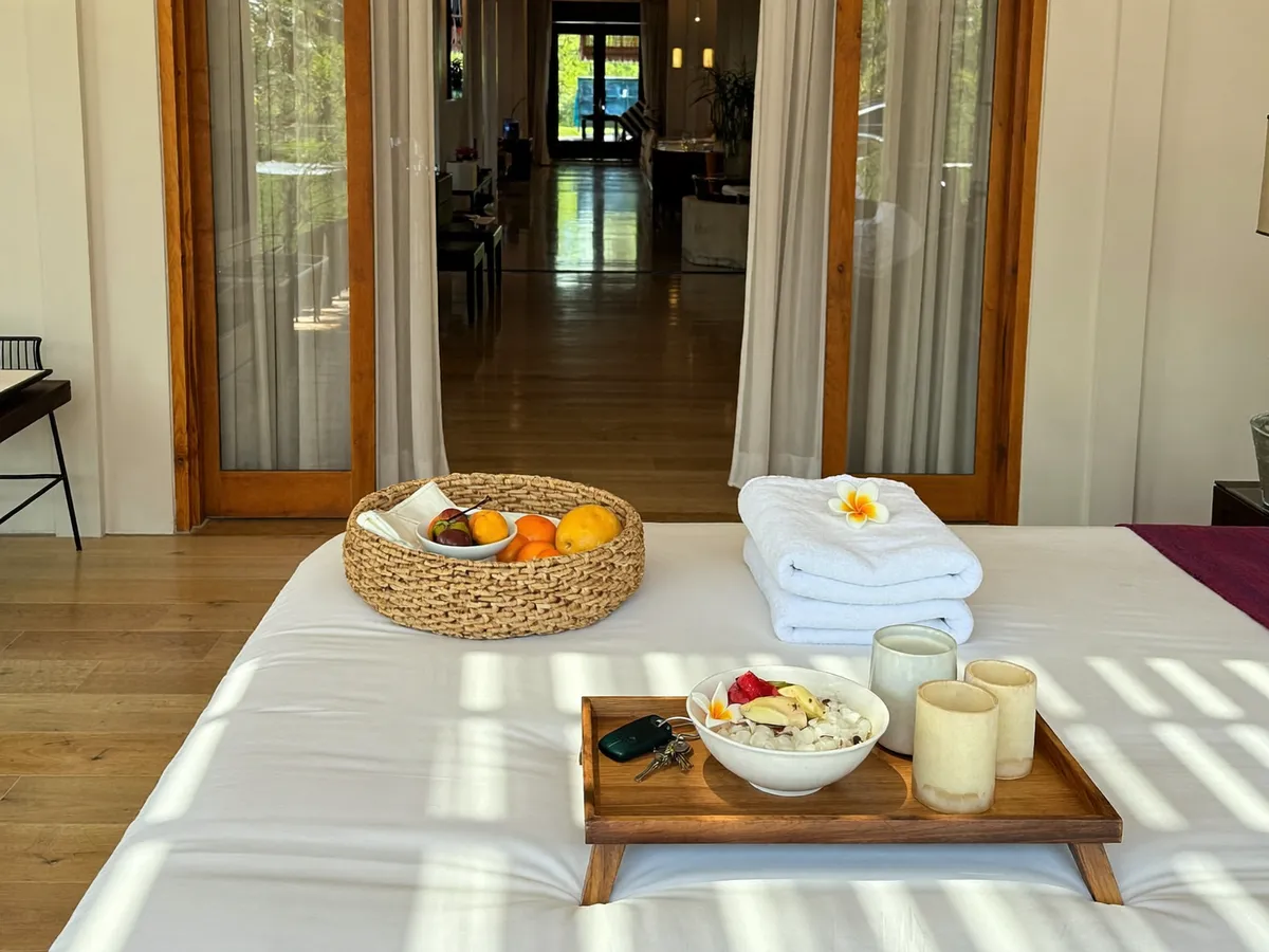 Guest welcome arrangement with towels and fruit basket in a managed Bali villa