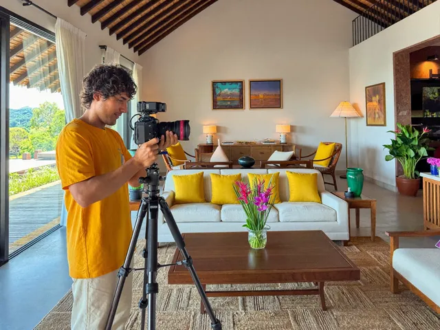 Professional photographer shooting a villa interior for a listing